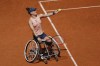 FILE - Netherlands' Diede de Groot serves against China's Zhu Zhenzhen in the women's wheelchair final match of the French Open tennis tournament at the Roland Garros stadium in Paris, France, Saturday, June 8, 2024. (AP Photo/Aurelien Morissard, File)