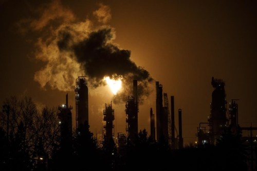 A flare stack lights the sky from the oil refinery in Edmonton on Friday December 28, 2018. THE CANADIAN PRESS/Jason Franson