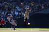 New York Mets shortstop Francisco Lindor, right, makes a jumping throw on a single hit by San Diego Padres' Xander Bogaerts during the eighth inning of a baseball game, Sunday, Aug. 25, 2024, in San Diego. (AP Photo/Brandon Sloter)
