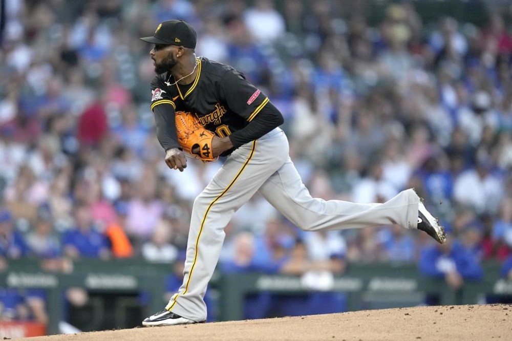 Pittsburgh Pirates starting pitcher Domingo Germán follows through during the first inning of a baseball game against the Chicago Cubs on Wednesday, Sept. 4, 2024, in Chicago. (AP Photo/Charles Rex Arbogast)
