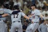 Detroit Tigers' Parker Meadows, right, celebrates with teammates Jace Jung, center, and Colt Keith, left, after hitting a grand slam during the ninth inning of a baseball game against the San Diego Padres, Thursday, Sept. 5, 2024, in San Diego. (AP Photo/Gregory Bull)