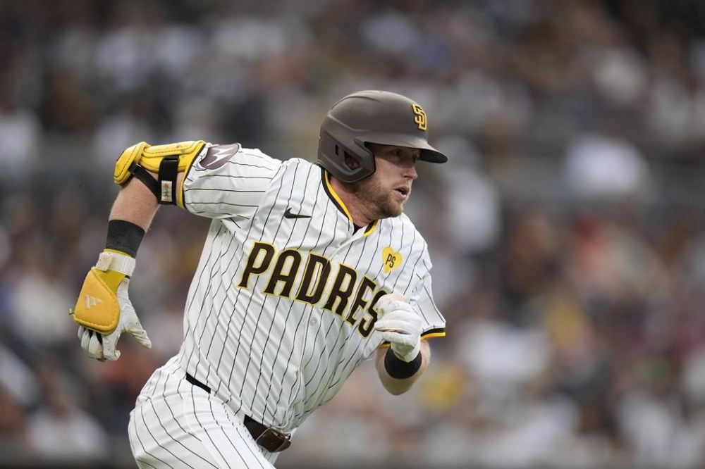 San Diego Padres' Jake Cronenworth watches his double during the second inning of a baseball game against the Detroit Tigers, Thursday, Sept. 5, 2024, in San Diego. (AP Photo/Gregory Bull)