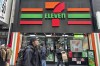 FILE - People shop at a 7-Eleven convenience store in New York, Tuesday, March 19, 2024. (AP Photo/Ted Shaffrey, File)