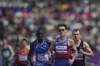 Michael Brannigan of the U.S, center, Britain's Ben Sandilands, right, and Italy's Ndiaga Dieng, left, compete in the men's 1500m T20 final during the 2024 Paralympics, Friday, Sept. 6, 2024, in Paris, France. (AP Photo/Thibault Camus)