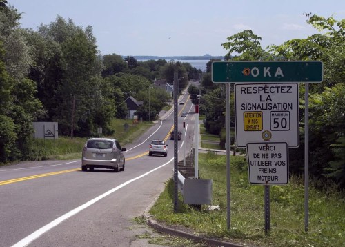 The Quebec Environment Department is taking soil samples from trucks headed to the Mohawk community of Kanesatake as part of an effort to fight illegal dumping in the area. Highway 344 heading into the town of Oka is seen Thursday, June 18, 2015, in Kanesatake, Que. THE CANADIAN PRESS/Ryan Remiorz