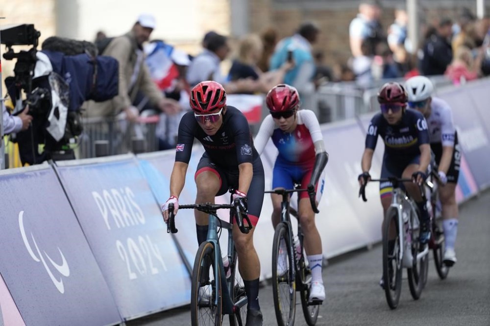 Britain's Sarah Storey, left, competes in the women's C4-5 road race during the 2024 Paralympics, Friday, Sept. 6, 2024, in Clichy-sous-Bois, France. (AP Photo/Aurelien Morissard)