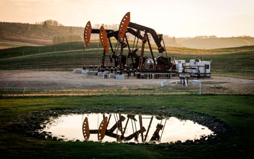 Pumpjacks draw out oil and gas from a well heads near Calgary on Sunday, May 12, 2024. THE CANADIAN PRESS/Jeff McIntosh