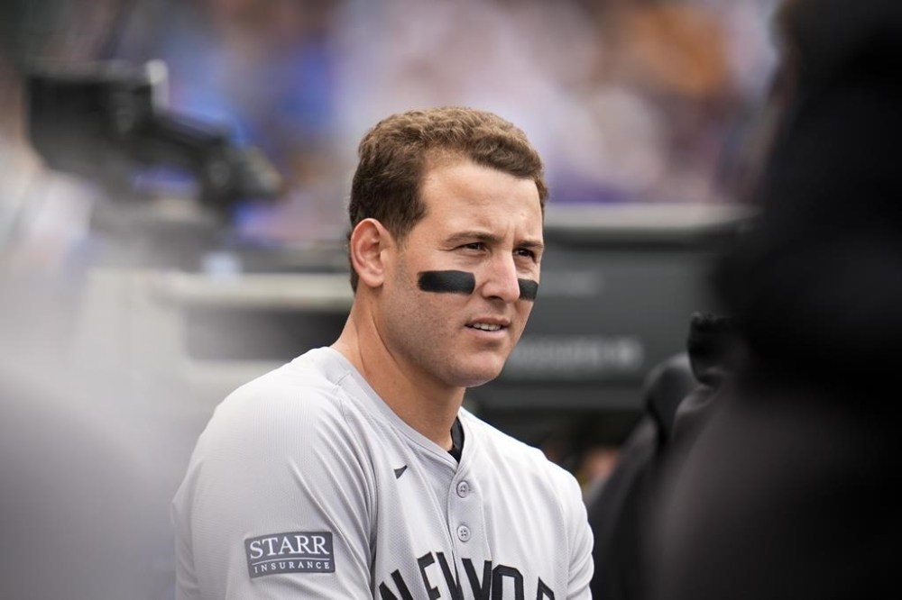 New York Yankees' Anthony Rizzo stands in the dugout during the first inning of a baseball game against his former team the Chicago Cubs, Friday, Sept. 6, 2024, in Chicago. (AP Photo/Erin Hooley)