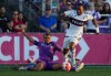 Pacific FC's Cedric Toussaint, back left, trips Vancouver Whitecaps' Levonte Johnson during the second half of a Canadian Championship semifinal soccer match, in Langford, B.C., on Wednesday, July 10, 2024. The Vancouver Whitecaps will be without several veterans for their Major League Soccer match against Dallas FC Saturday. THE CANADIAN PRESS/Darryl Dyck
