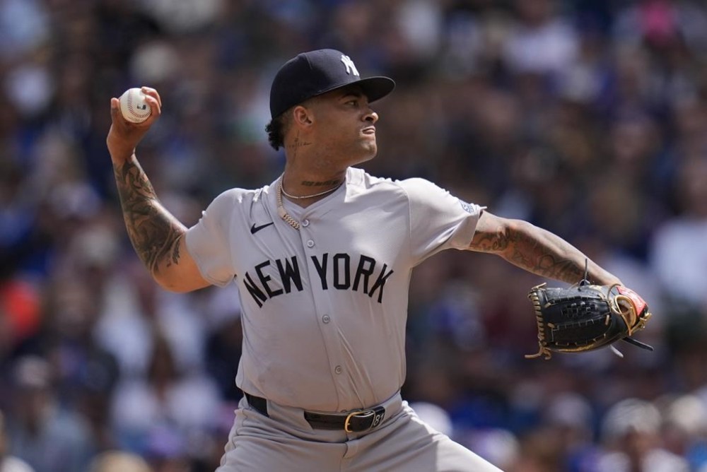 New York Yankees starting pitcher Luis Gil throws against the Chicago Cubs during the first inning of a baseball game Friday, Sept. 6, 2024, in Chicago. (AP Photo/Erin Hooley)
