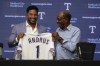 Texas Rangers' Elvis Andrus, left, smiles with Los Angeles Angels Manager Ron Washington after Andrus signed a one-day contract with the Rangers during a news conference before the baseball game between the Rangers and the Los Angeles Angels, Friday, Sept. 6, 2024, in Arlington, Texas. Andrus announced his retirement as an active Texas Rangers player after playing the first 12 seasons of his 15-year Major League career in Arlington. (AP Photo/LM Otero)