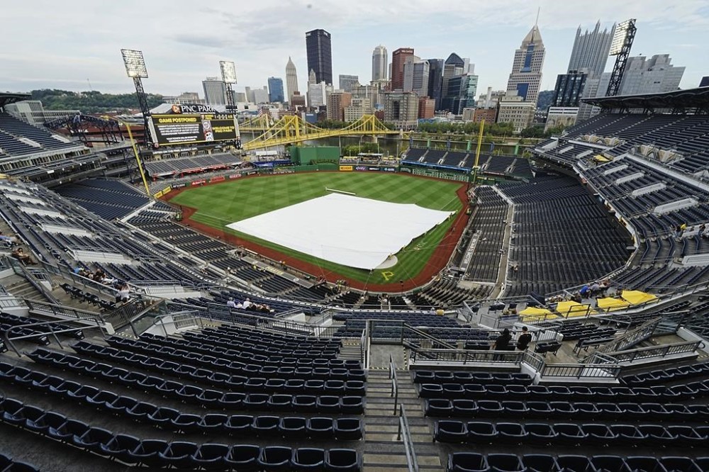 The scoreboard at PNC Park announces the postponement of a baseball game between the Pittsburgh Pirates and the Washington Nationals in Pittsburgh, Friday, Sept. 6, 2024. It will be played as part of a split doubleheader Saturday, Sept 7, 2024. (AP Photo/Gene J. Puskar)