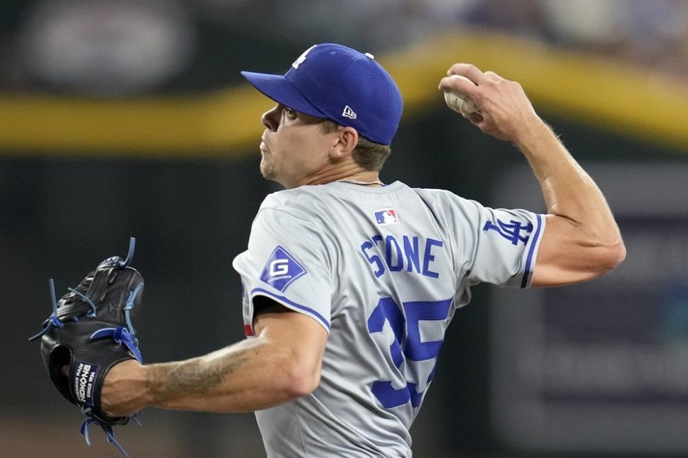 Los Angeles Dodgers starting pitcher Gavin Stone throws against the Arizona Diamondbacks during the second inning of a baseball game Saturday, Aug. 31, 2024, in Phoenix. (AP Photo/Ross D. Franklin)