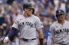 New York Yankees' Aaron Judge, left, and Juan Soto return to the dugout after they both scored on a single by Austin Wells during the third inning of a baseball game against the Chicago Cubs, Friday, Sept. 6, 2024, in Chicago. (AP Photo/Erin Hooley)
