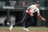 Texas Rangers third baseman Josh Jung moves to field a ground ball from Los Angeles Angels' Zach Neto in the first inning of a baseball game, Friday, Sept. 6, 2024, in Arlington, Texas. (AP Photo/Tony Gutierrez)