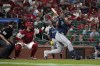 Seattle Mariners' Cal Raleigh follows through on a two-run double during the ninth inning of a baseball game against the St. Louis Cardinals Friday, Sept. 6, 2024, in St. Louis. (AP Photo/Jeff Roberson)