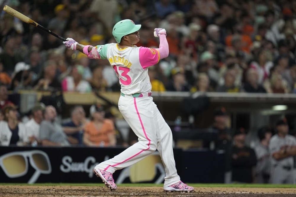 San Diego Padres' Manny Machado watches his home run during the eighth inning of a baseball game against the San Francisco Giants, Friday, Sept. 6, 2024, in San Diego. (AP Photo/Gregory Bull)