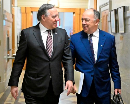 Quebec Premier Francois Legault, left, walks to a cabinet meeting with Quebec Health Minister Christian Dube in Quebec City, Wednesday, March 29, 2023. Quebec announced Saturday that it will authorize early requests for medical assistance in dying, without waiting for Ottawa to amend Canada’s Criminal Code. THE CANADIAN PRESS/Jacques Boissinot
