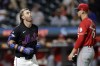 New York Mets' Jeff McNeil, left, reacts after being hit by a pitch from Cincinnati Reds' Brandon Williamson during the fifth inning of a baseball game Friday, Sept. 6, 2024, in New York. (AP Photo/Adam Hunger)