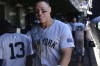 New York Yankees' Aaron Judge celebrates with teammates in the dugout after scoring on a throwing error by the catcher during the sixth inning of a baseball game against the Chicago Cubs in Chicago, Saturday, Sept. 7, 2024. (AP Photo/Paul Beaty)