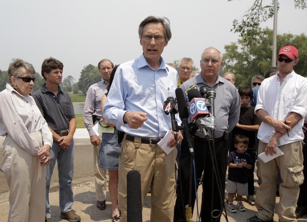 FILE - Charles McMillan, center, director of Los Alamos Laboratory, talks to reporters during a news conference in Los Alamos, N.M., June 28, 2011. (AP Photo/Jae C. Hong, File)