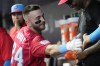 Miami Marlins' Connor Norby is congratulated by his teammates after hitting a two-run home run during the first inning of a baseball game against the Philadelphia Phillies, Saturday, Sept. 7, 2024, in Miami. (AP Photo/Marta Lavandier)