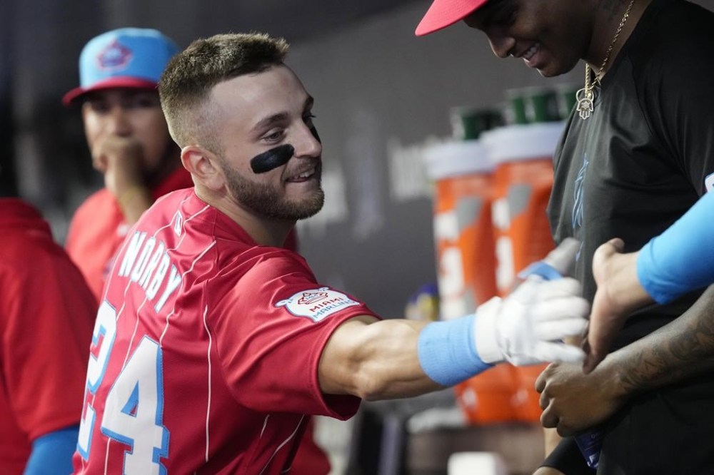 Miami Marlins' Connor Norby is congratulated by his teammates after hitting a two-run home run during the first inning of a baseball game against the Philadelphia Phillies, Saturday, Sept. 7, 2024, in Miami. (AP Photo/Marta Lavandier)