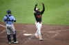 Baltimore Orioles' Cedric Mullins, right, celebrates his home run during the sixth inning of a baseball game as Tampa Bay Rays catcher Logan Driscoll looks on at left, Saturday, Sept. 7, 2024, in Baltimore. (AP Photo/Nick Wass)