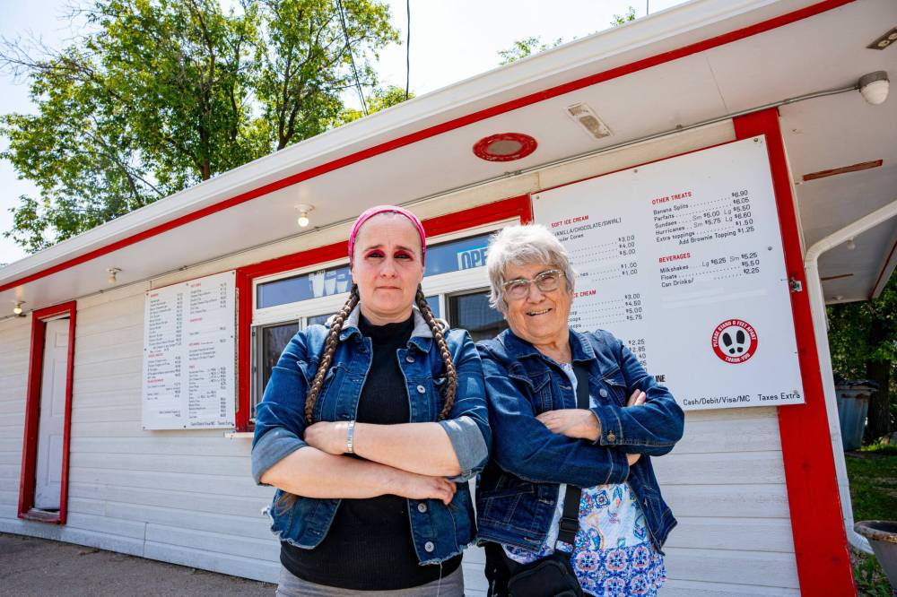 NIC ADAM / FREE PRESS
                                Tessa Galbichka (left) and her mother Shannon Galbichka, Brian’s Drive-Inn owner, outside the popular summer stop in Lorette.