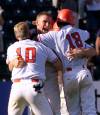 TOM HANSON / THE CANADIAN PRESS FILES
                                Team Canada’s Lee Delfino from Pickering, Ont. (centre) celebrates with teammates Aaron Guiel (left) of Langley, B.C. and Julien Lepine (right) of Charlesbourg, Que. after Lepine scored the winning run in the bottom of the 11th inning against the United States during Pan American Games baseball action in Winnipeg Monday July 26, 1999. Canada won 7-6.