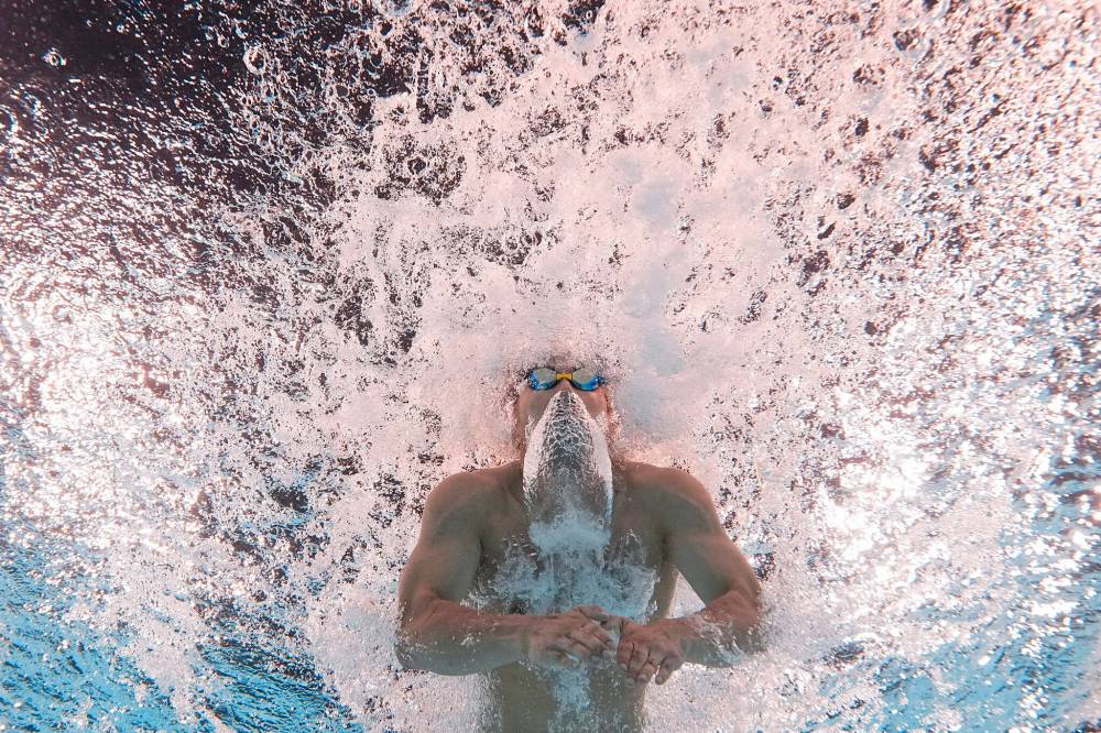 David J. Phillip / The Associated Press
Tomoru Honda, of Japan, competes during a heat in the men’s 200-meter butterfly, Tuesday in Paris.