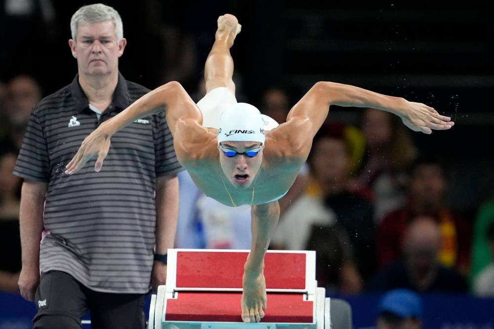 Matthias Schrader / The Associated Press
Honduras swimmer Julio Horrego competes during a heat in the men’s 200-metre breaststroke Tuesday in Nanterre, France.