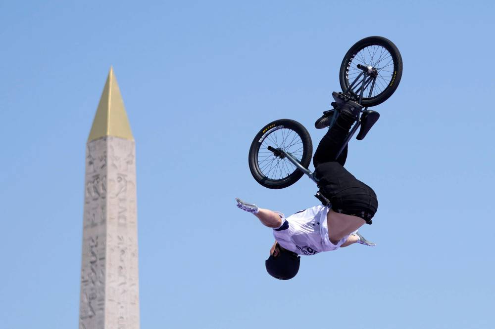 Frank Franklin II / The Associated Press
American Marcus Christopher soars during the BMX freestyle men’s park qualification with Paris’s Luxor Obelisk in the background, Tuesday.