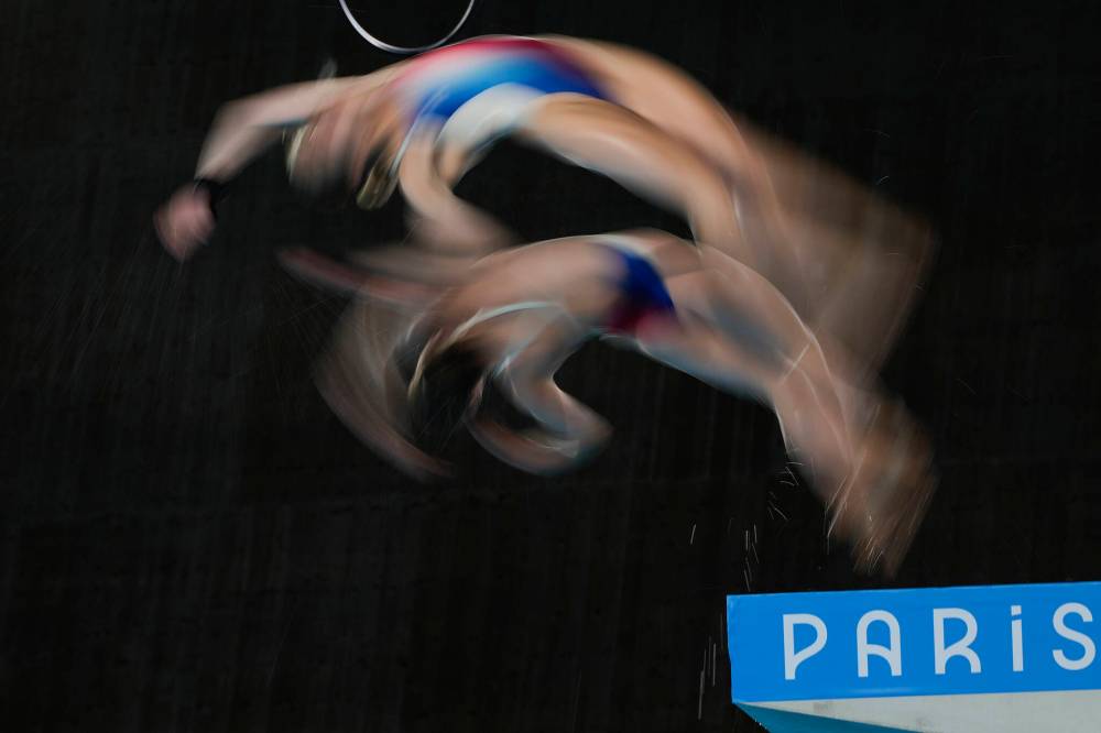 Jin Lee Man / The Associated Press
France’s Jade Gillet and Emily Hallifax warm up before competing in the women’s synchronized 10-metre platform diving final Wednesday in Saint-Denis, France.