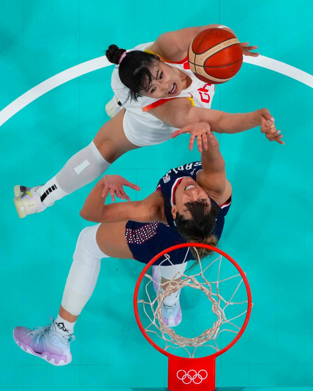 Brian Snyder / Pool Photo via / The Associated Press
China’s Li Yueru shoots over Serbia’s Tina Kajisnik during women’s basketball action Wednesday in Villeneuve-d’Ascq, France.