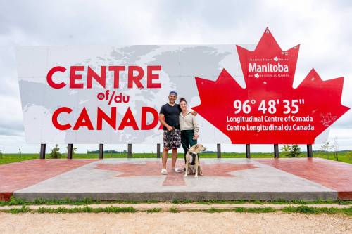 NIC ADAM / FREE PRESS Simon Ferreira, Sara Mihaly, and Arlo (from left) from Hamilton Ontario pictured at the longitudinal centre of Canada, just off hwy 1 Tuesday. 240723 - Tuesday, July 23, 2024. Reporter: Jura