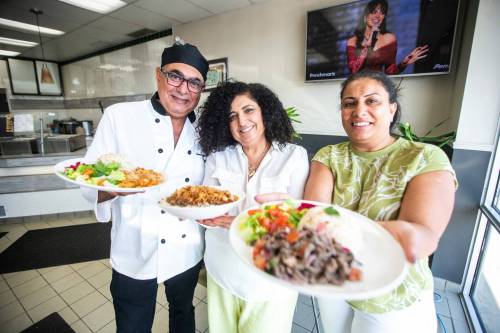 MIKAELA MACKENZIE / FREE PRESS 	 Chef George Abraham (left) and pavilion co-ordinators Hala Salama (centre) and Omneya Khalifa with Egyptian dishes at House of Taste on Wednesday, July 31, 2024. For Eva story.
                                MIKAELA MACKENZIE / FREE PRESS
                                Chef George Abraham (left) and pavilion co-ordinators Hala Salama (centre) and Omneya Khalifa with Egyptian dishes at House of Taste on Wednesday, July 31, 2024. For Eva story.