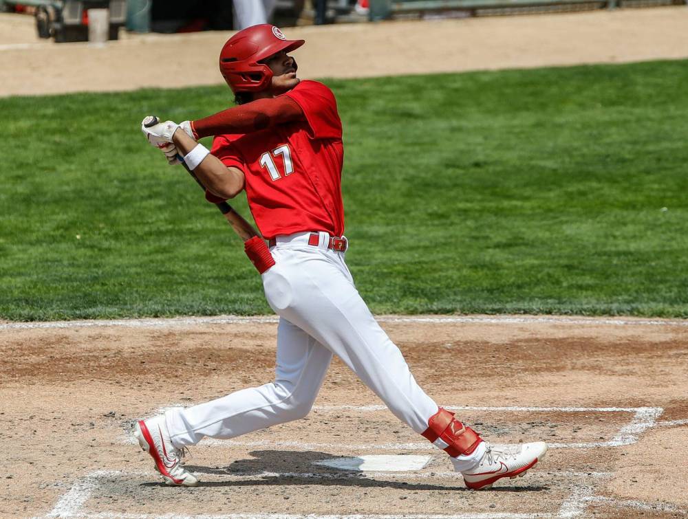 JOHN WOODS / FREE PRESS Winnipeg Goldeyes’ Roby Enriquez 17) watches his hit during their game against the Fargo-Moorhead Redhawks in Winnipeg Sunday, July 7, 2024.