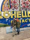 Supplied Winnipeg’s Brent DePape, along with longtime Canadian volunteer April Huggett, at the sign marking the border of Ukraine’s eastern Donetsk Oblast region during DePape’s third volunteer trip to the country earlier this year.