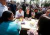 Prime Minister Justin Trudeau meets with healthcare workers and others Tuesday during an outdoor lunch at Victoria General Hospital sponsored by Winnipeg South Liberal MP Terry Duguid. (John Woods / The Canadian Press)