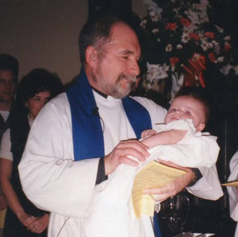 Supplied photo
Rev. Don Ross baptizes his first of eight grandchildren.