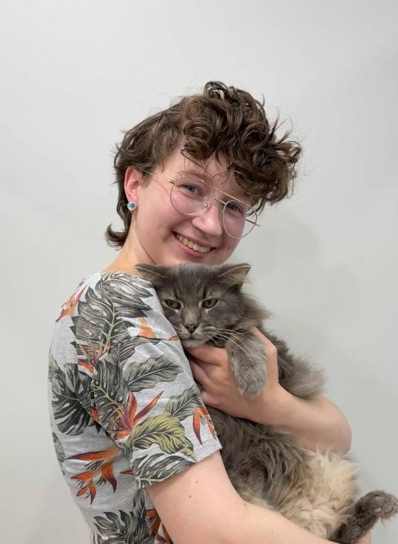 Bella is reunited with her cat Fluffy after he went missing five years ago. (Supplied)