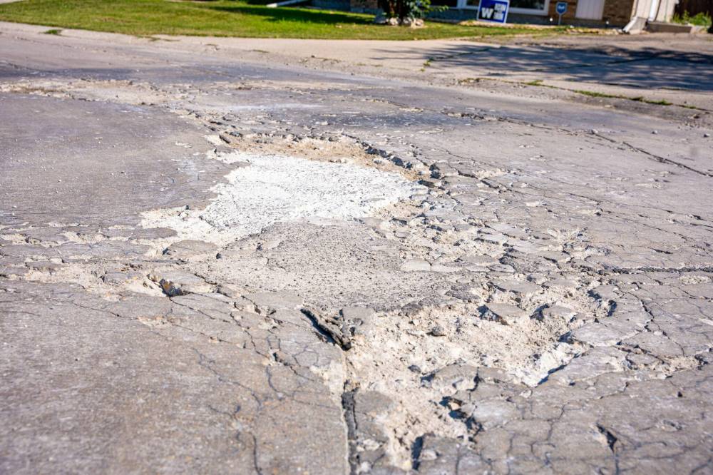 Hiebert filled the pothole himself last summer with three 20-pound bags of concrete. In June, he dumped another bag in. (Nic Adam / Free Press)