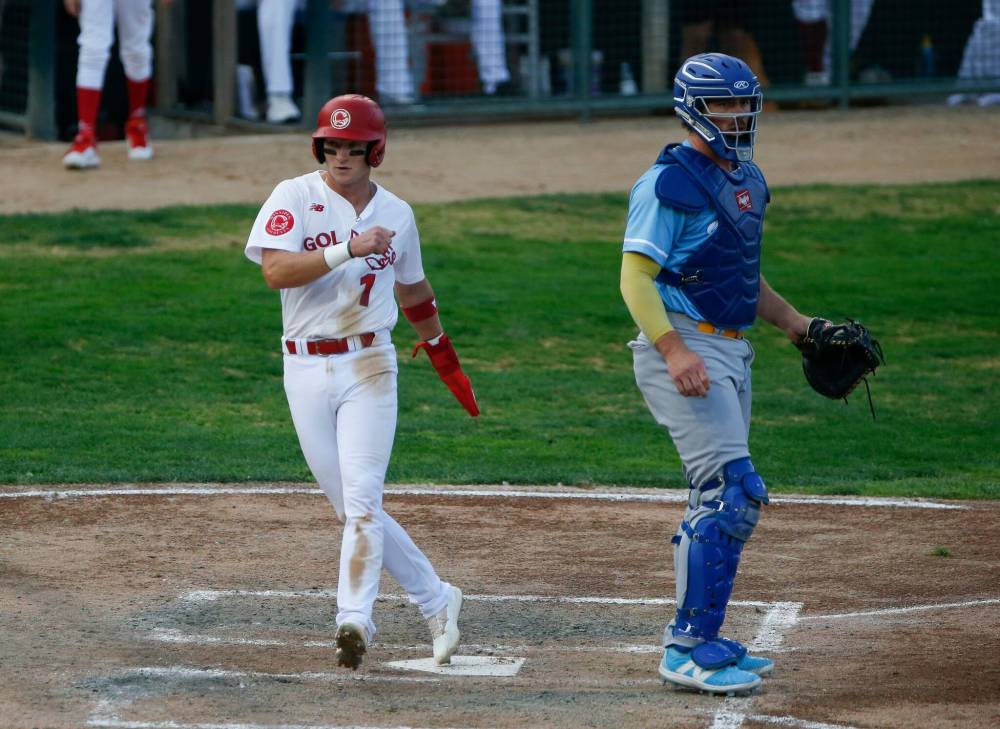 JOHN WOODS / FREE PRESS
                                Andy Armstrong scores a run Tuesday against the Sioux Falls Canaries in the Goldeyes’ victory.