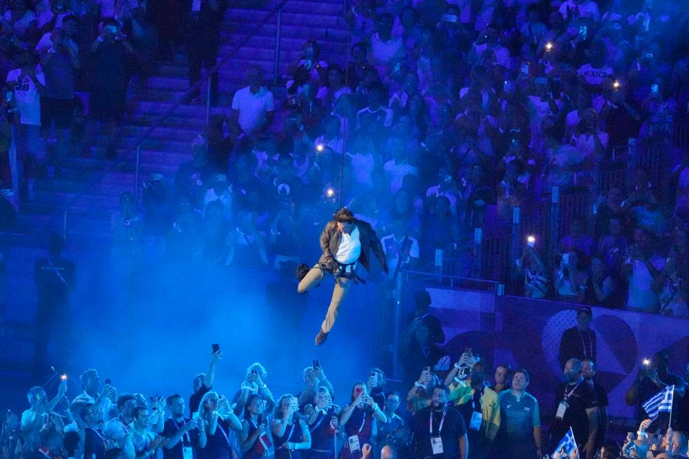 Tom Cruise was lowered into the stadium during the 2024 Summer Olympics closing ceremony at the Stade de France last Sunday. (Martin Meissner / The Associated Press