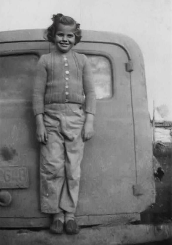 Supplied
Shirley is all smiles as a young girl on the back of a school van, circa 1946.