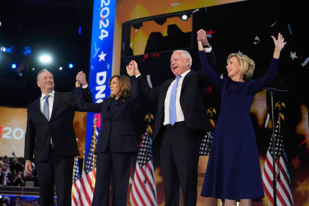 Erin Hooley / The Associated Press
Democratic presidential nominee U.S. Vice-President Kamala Harris with husband Douglas Emhoff and Democratic vice-presidential candidate Minnesota Gov. Tim Walz with his wife Gwen Walz celebrate during the Democratic National Convention Aug. 22.