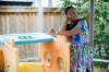 MIKE DEAL / FREE PRESS Abiodun Adetu, who immigrated to Canada from Nigeria in 2019, cheerfully shares that her three children’s time spent playing in the neighbourhood is like a melting pot of diverse cultures. See Tahira Khan story on preserving languages. 240827 - Tuesday, August 27, 2024.
                                MIKE DEAL / FREE PRESS 
                                Abiodun Adetu, who immigrated to Canada from Nigeria in 2019, says her three children’s time spent playing in the neighbourhood is a melting pot of diverse cultures.