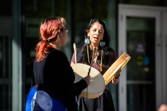 Mandy Fenner (left) and Amber Flett sing a healing song in front of the law courts during the sentencing hearing for Jeremy Skibicki on Wednesday morning. (Mikaela MacKenzie / Free Press)
