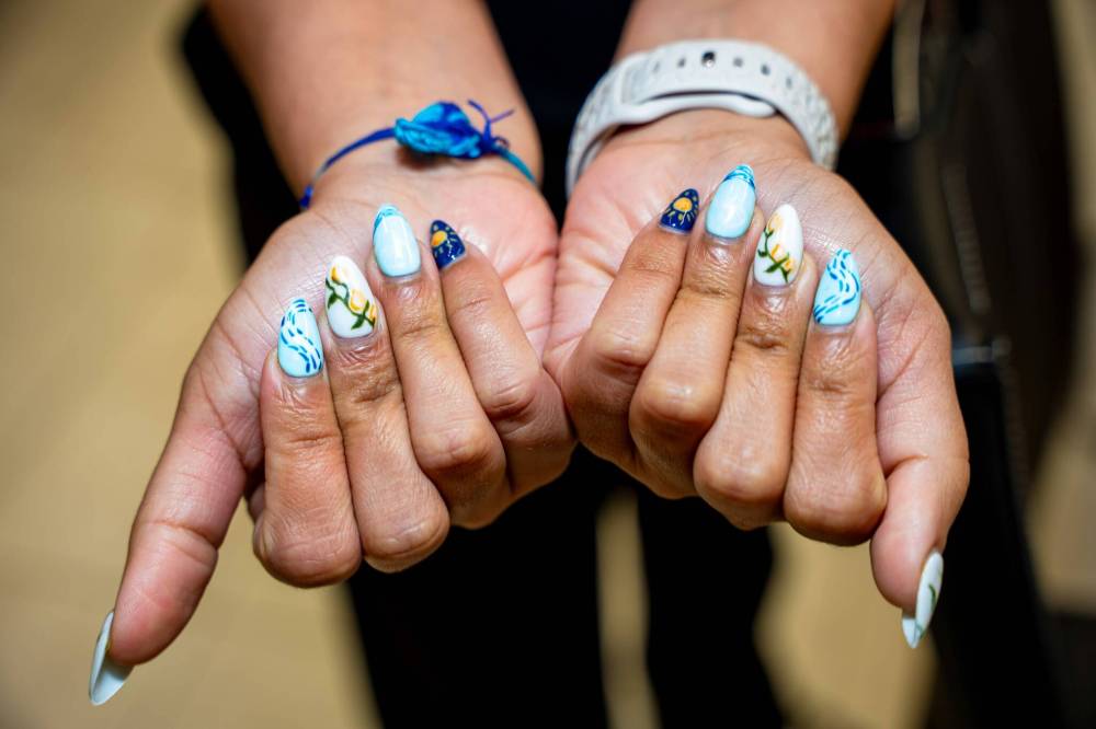 NIC ADAM
Gagan Bhullar shows off her nails
after an appointment Friday in Winnipeg.